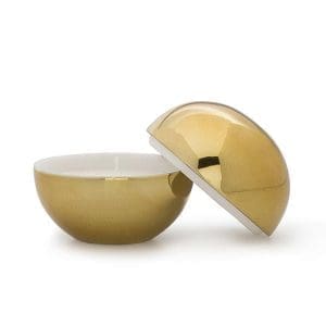 Golden decorative candle holder with removable lid for home decor.