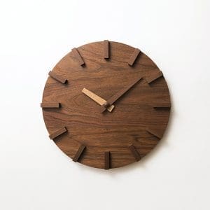 Wooden wall clock with minimalist design and natural finish.