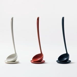 White, red, and black wireless earbuds on a white background.