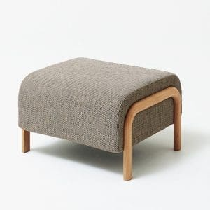 Modern upholstered ottoman with wooden legs for stylish interior decor.