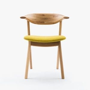 Modern wooden chair with yellow cushion for stylish interior decor