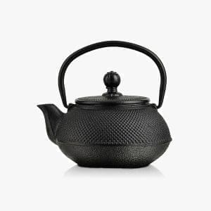 Traditional cast iron teapot for brewing tea in style.